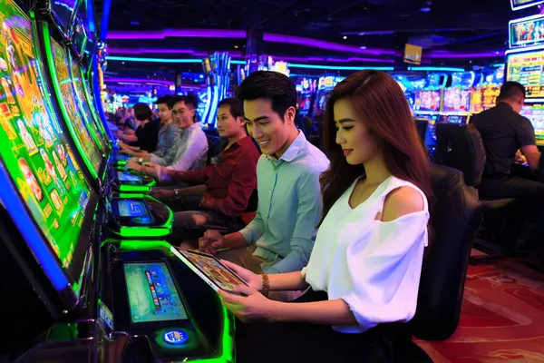 A confident dealer surrounded by casino chips inviting players to access their JILIX account, reflecting quick and easy login options.